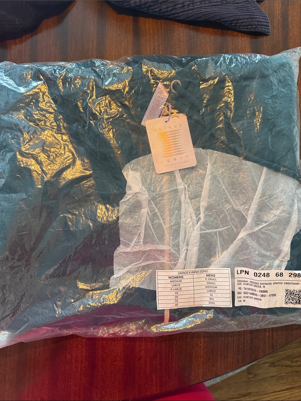 Fenty Savage Teal Green onesie